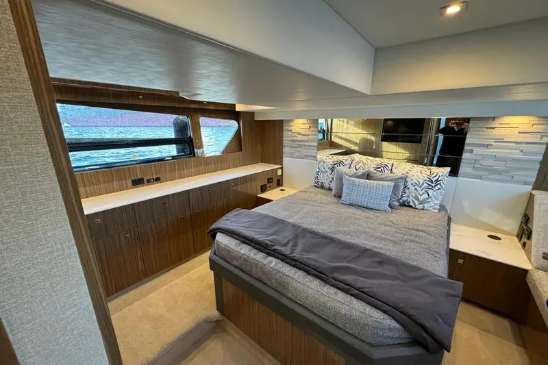 Slide: The Image of Luxurious bedroom interior of 2024 Cruisers Yachts 50 Cantius with elegant wood finishes. - 40