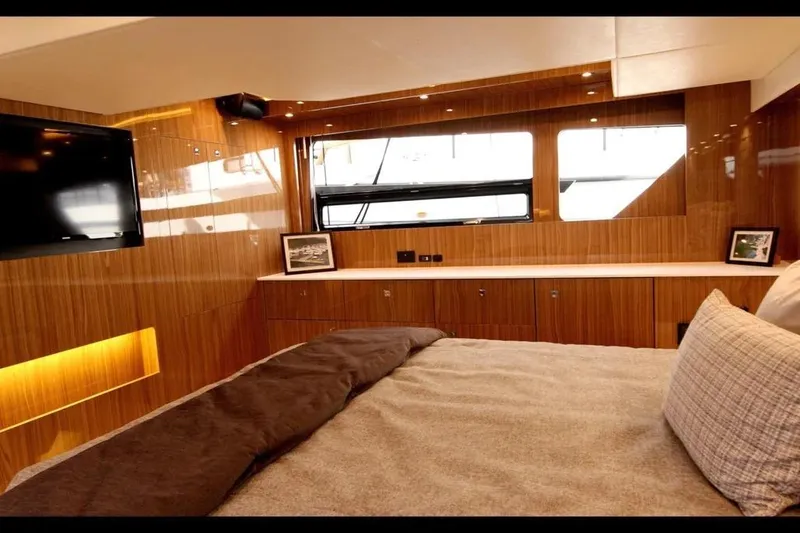Slide: The Image of Luxurious interior of 2024 Cruisers Yachts 50 Cantius with wood paneling and modern amenities. - 41