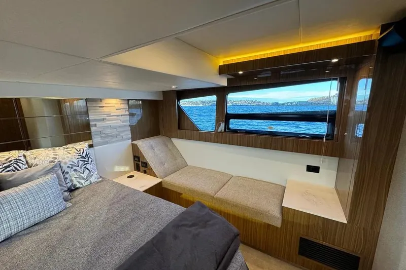 Slide: The Image of Luxurious interior of 2024 Cruisers Yachts 50 Cantius with scenic window view. - 43