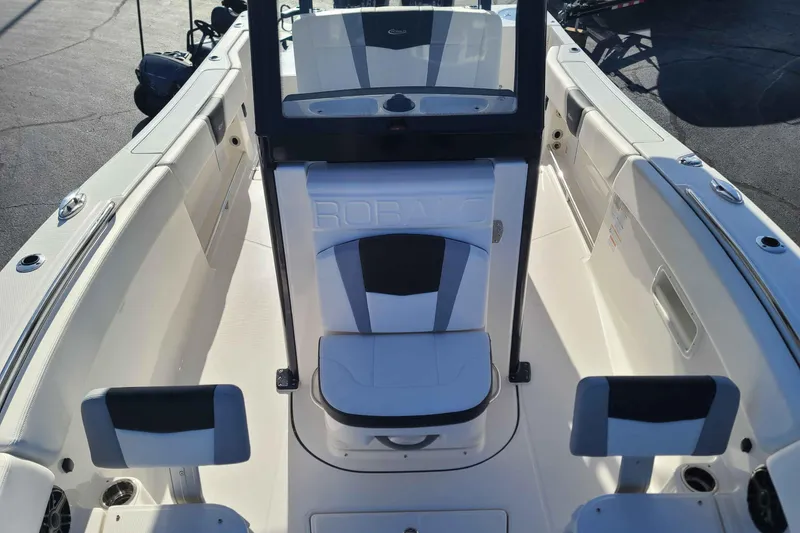 Slide: The Image of 2023 Robalo R270 Center Console boat interior with seating and console view. - 12
