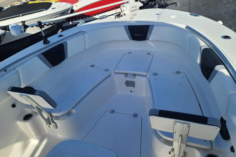Slide: The Image of 2023 Robalo R270 Center Console boat interior with seating and storage compartments. - 14