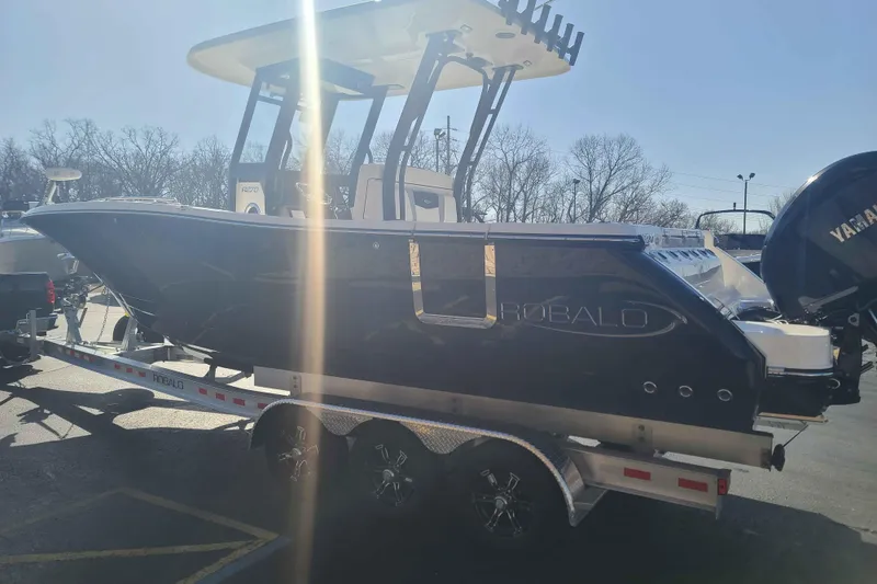 Slide: The Image of 2023 Robalo R270 Center Console boat on trailer, side view in sunlight. - 3