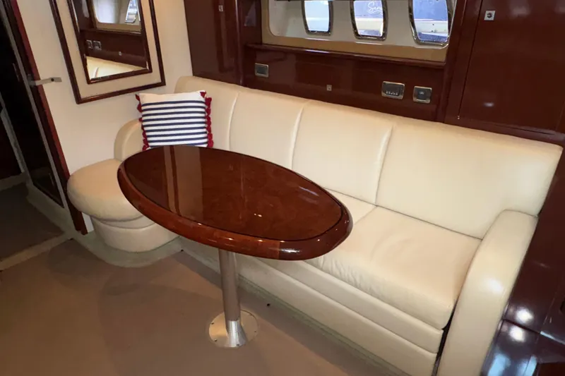 Slide: The Image of Luxurious interior of 2008 Sea Ray 40 Sundancer with cream sofa and oval table. - 15