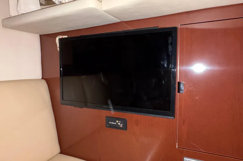Slide: The Image of Flat-screen TV in 2008 Sea Ray 40 Sundancer yacht interior, mounted on wooden panel. - 16