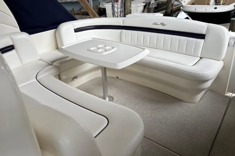Slide: The Image of Luxurious seating area on a 2008 Sea Ray 40 Sundancer yacht with a central table. - 3