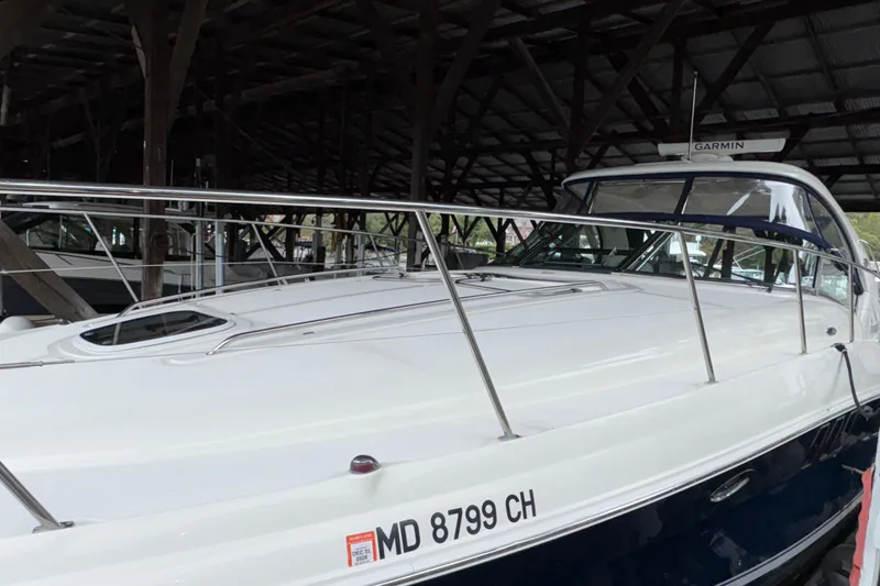 Slide: The Image of 2008 Sea Ray 40 Sundancer yacht docked in a covered marina. - 32