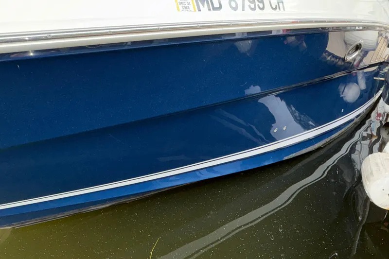 Slide: The Image of Blue hull of a 2008 Sea Ray 40 Sundancer boat docked in water. - 33