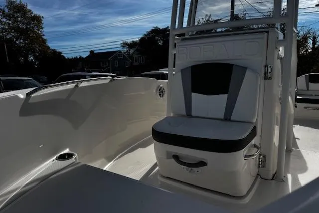 Slide: The Image of 2024 Robalo R180 Center Console boat deck with textured surface and metal hinges. - 10