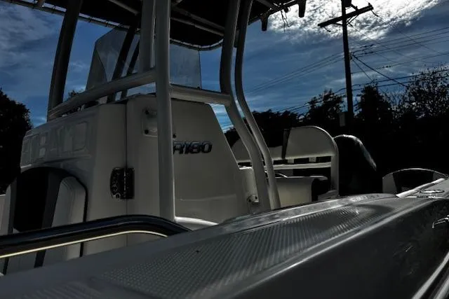 Slide: The Image of 2024 Robalo R180 Center Console boat interior with seating and storage. - 11