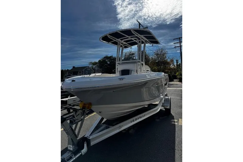 Slide: The Image of 2024 Robalo R180 Center Console boat interior with seating and storage. - 4