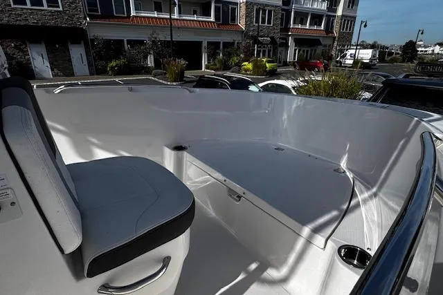 Slide: The Image of 2024 Robalo R180 Center Console boat interior with steering wheel and seating. - 8