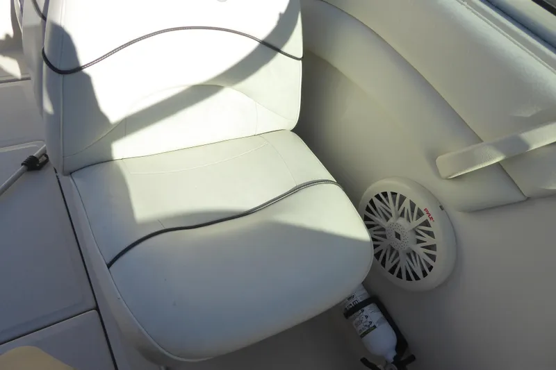 Slide: The Image of White seat and speaker on 2004 Sea Ray 225 Weekender boat interior. - 12