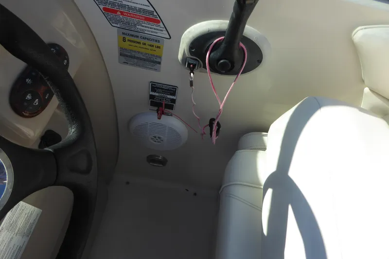 Slide: The Image of Interior view of 2004 Sea Ray 225 Weekender boat dashboard and seating area. - 14