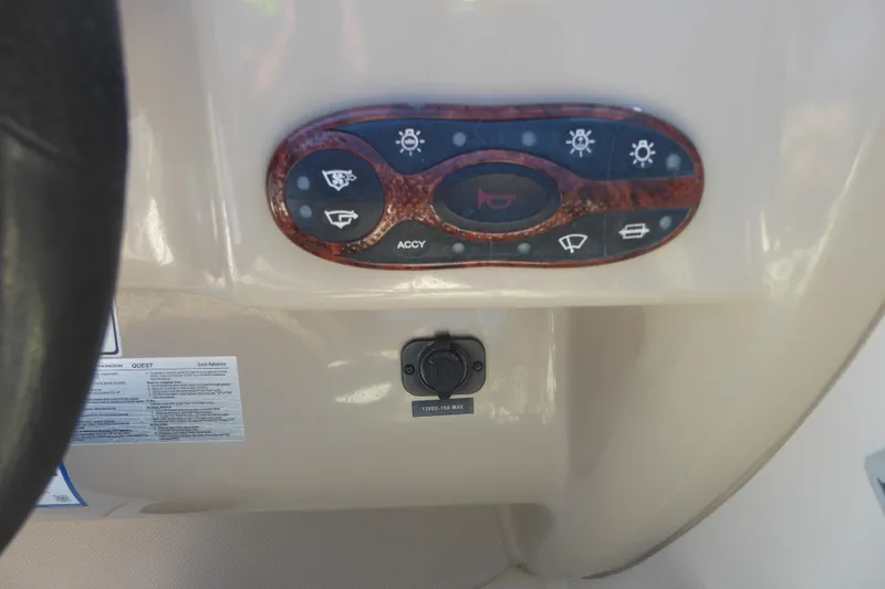 Slide: The Image of Control panel of a 2004 Sea Ray 225 Weekender boat with various switches. - 15