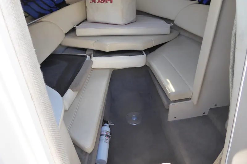 Slide: The Image of Interior cabin of 2004 Sea Ray 225 Weekender with seating and life jackets. - 30