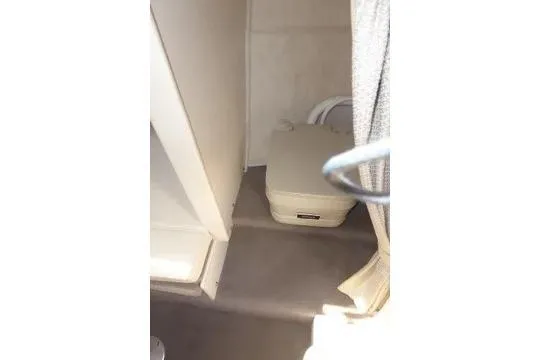 Slide: The Image of Interior cabin of 2004 Sea Ray 225 Weekender boat with portable toilet. - 31
