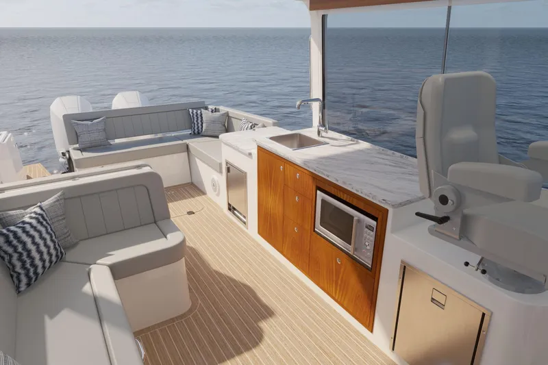 Slide: The Image of Luxurious 2026 MJM 38R yacht interior with seating, kitchenette, and ocean view. - 14