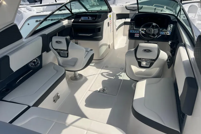 Slide: The Image of 2025 Chaparral 270 OSX boat interior with modern seating and steering console. - 10