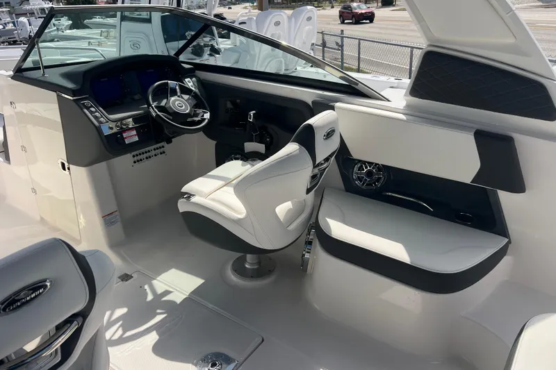 Slide: The Image of 2025 Chaparral 270 OSX boat interior with modern helm and seating. - 12