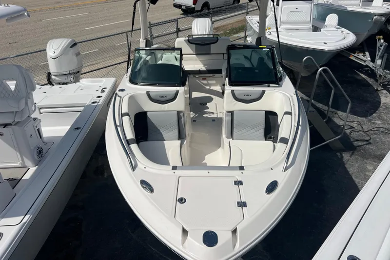 Slide: The Image of 2025 Chaparral 270 OSX boat with sleek design and spacious seating. - 18