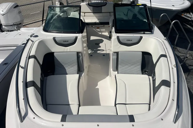 Slide: The Image of 2025 Chaparral 270 OSX boat interior with sleek seating and modern design. - 19