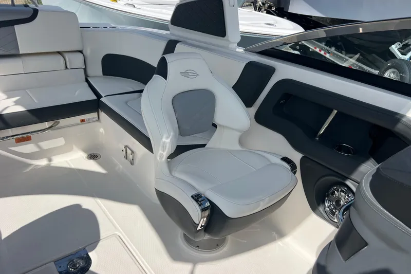Slide: The Image of 2025 Chaparral 270 OSX boat interior with luxurious seating and modern design. - 22