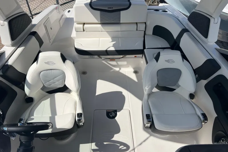 Slide: The Image of Interior of 2025 Chaparral 270 OSX boat with luxurious white seating. - 24