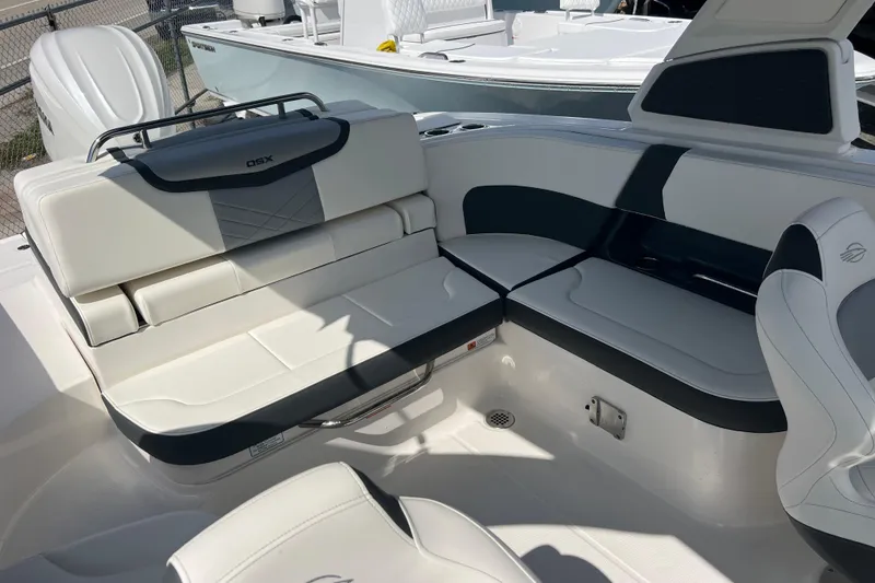 Slide: The Image of 2025 Chaparral 270 OSX boat interior with luxurious seating and modern design. - 25