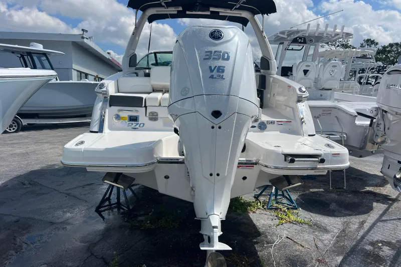 Slide: The Image of 2025 Chaparral 270 OSX boat with Yamaha 350 V6 engine, docked outdoors. - 4