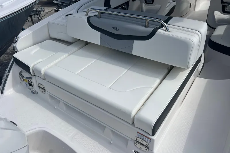 Slide: The Image of 2025 Chaparral 270 OSX boat interior with white cushioned seating. - 6