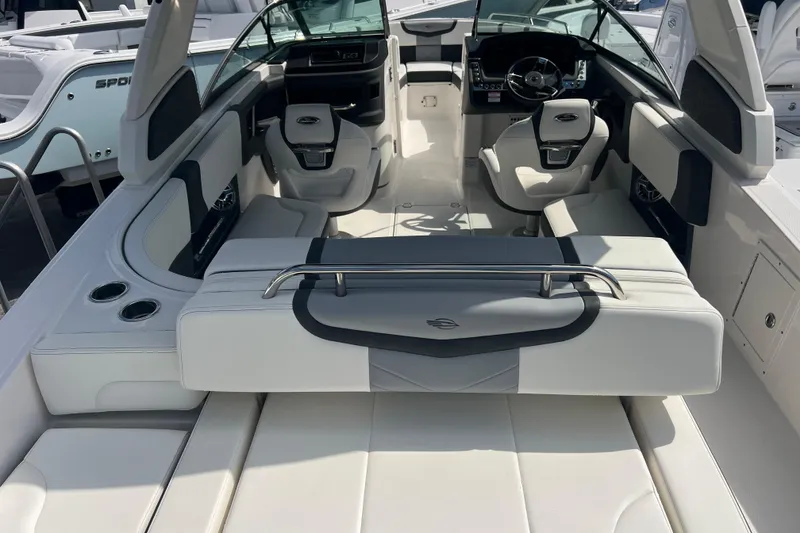 Slide: The Image of 2025 Chaparral 270 OSX boat interior with modern seating and sleek design. - 9