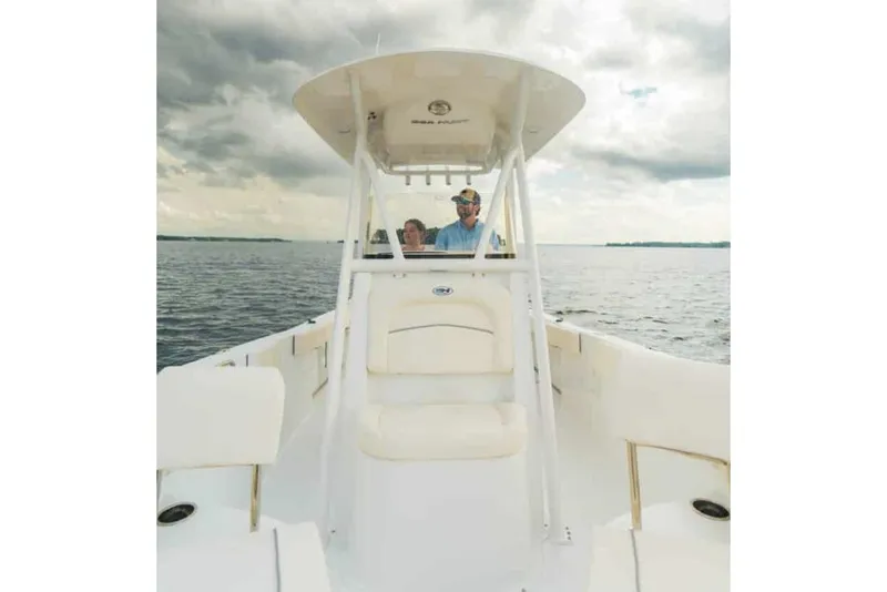 Slide: The Image of Manufacturer Provided Image: 2026 Sea Hunt Ultra 229 boat on open water under cloudy sky. - 5