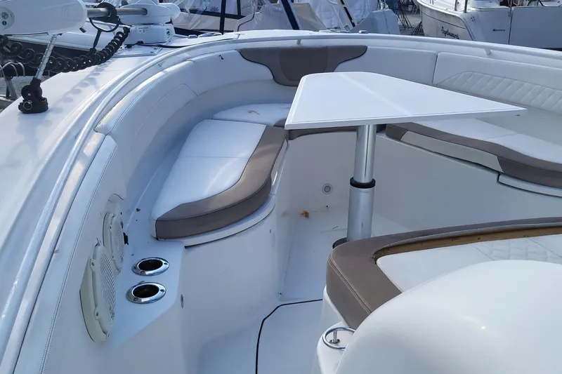 Slide: The Image of 2018 Edgewater 370CC boat interior with seating and table, featuring modern design. - 13