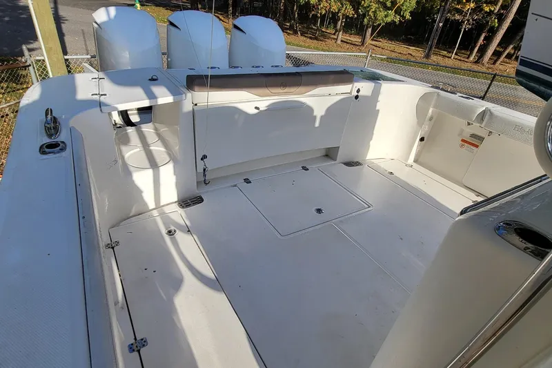 Slide: The Image of 2018 Edgewater 370CC boat deck with spacious seating and storage compartments. - 5