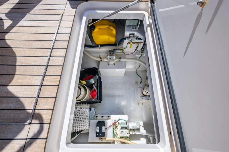 Slide: The Image of Storage compartment on 2008 Viking 74 Enclosed Bridge yacht, featuring equipment and wiring. - 20
