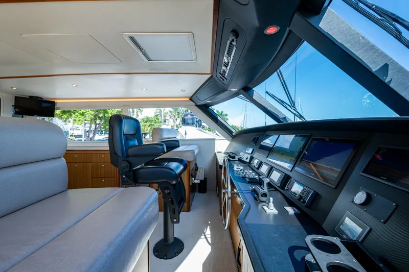 Slide: The Image of Interior of 2008 Viking 74 Enclosed Bridge yacht with modern navigation equipment. - 32