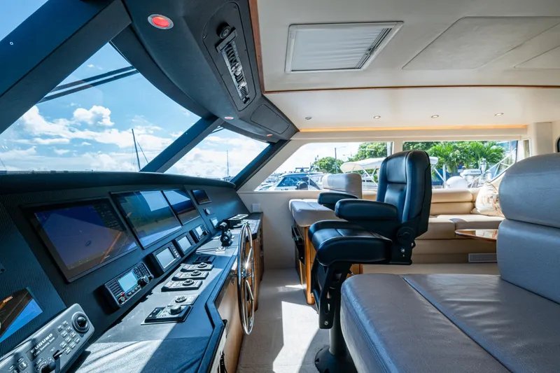 Slide: The Image of Luxurious interior of 2008 Viking 74 Enclosed Bridge yacht with modern navigation equipment. - 33