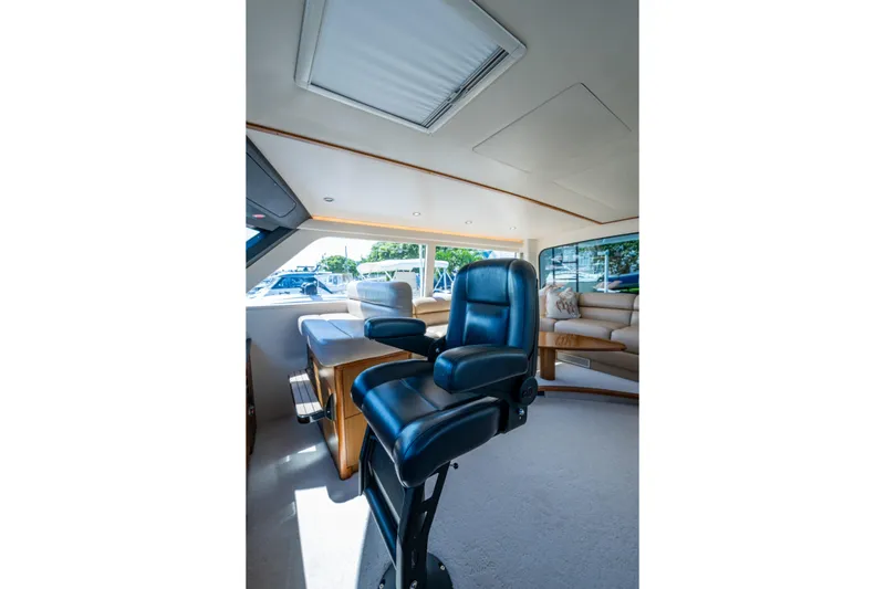 Slide: The Image of Luxurious interior of 2008 Viking 74 Enclosed Bridge yacht with leather seating. - 36