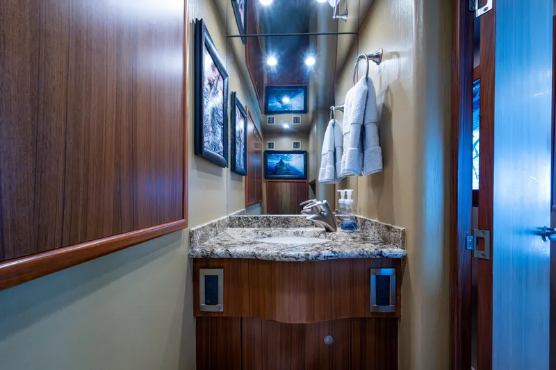 Slide: The Image of Luxurious bathroom in 2008 Viking 74 Enclosed Bridge yacht with granite countertop. - 37
