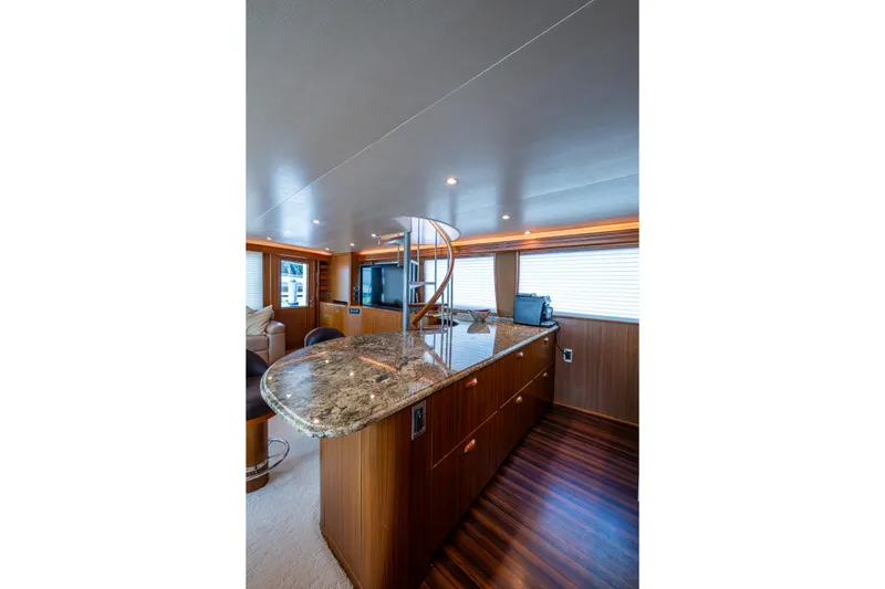 Slide: The Image of Luxurious interior of 2008 Viking 74 Enclosed Bridge yacht with elegant wood and granite finishes. - 41