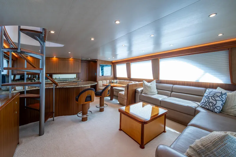 Slide: The Image of Luxurious interior of 2008 Viking 74 Enclosed Bridge yacht with elegant seating and spiral staircase. - 45