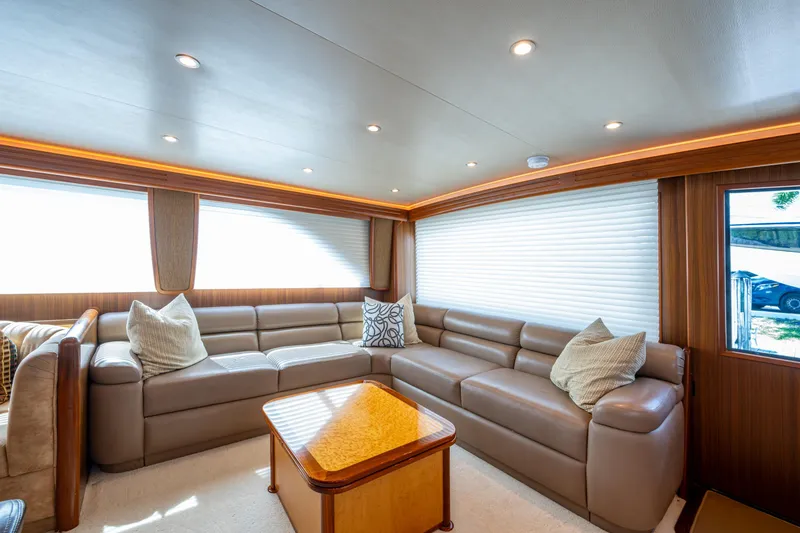 Slide: The Image of Luxurious interior of 2008 Viking 74 Enclosed Bridge yacht with plush seating and elegant decor. - 47