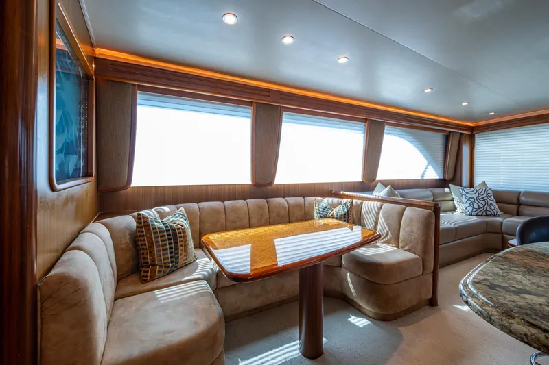 Slide: The Image of Luxurious interior of 2008 Viking 74 Enclosed Bridge yacht with plush seating and elegant decor. - 50