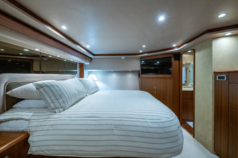 Slide: The Image of Luxurious bedroom interior of 2008 Viking 74 Enclosed Bridge yacht with modern lighting. - 53