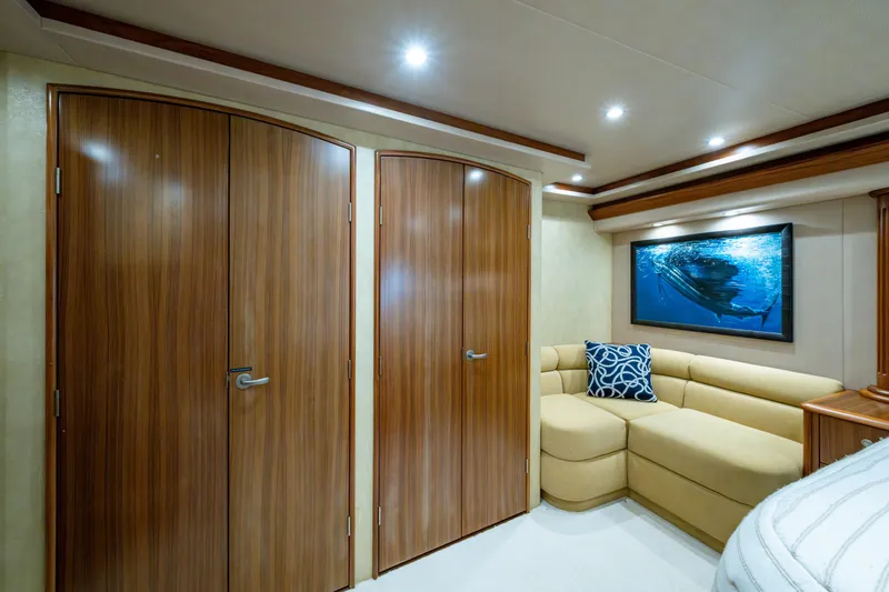 Slide: The Image of Luxurious interior of 2008 Viking 74 Enclosed Bridge yacht with elegant wood doors and cozy seating. - 54