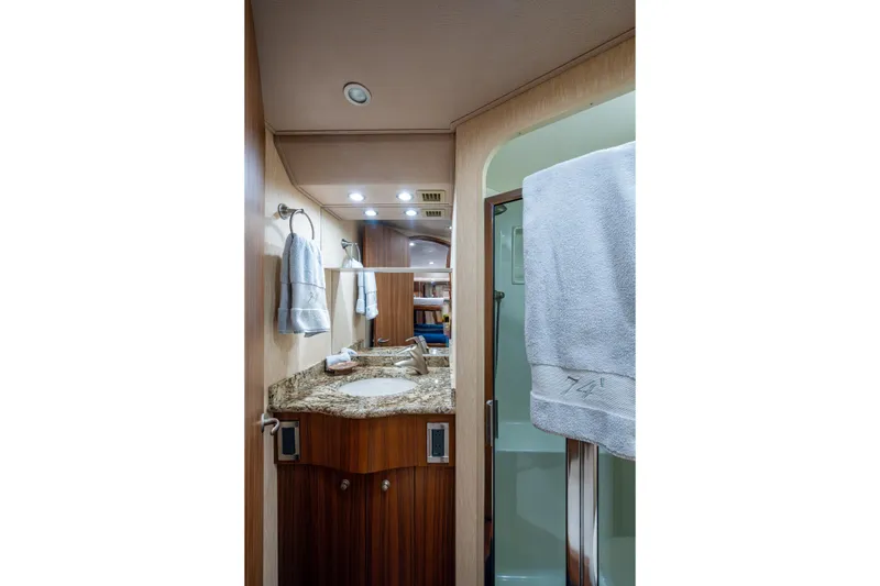 Slide: The Image of Luxurious bathroom in 2008 Viking 74 Enclosed Bridge yacht with granite countertop. - 63