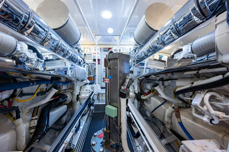 Slide: The Image of Engine room of 2008 Viking 74 Enclosed Bridge yacht, showcasing advanced machinery and equipment. - 72