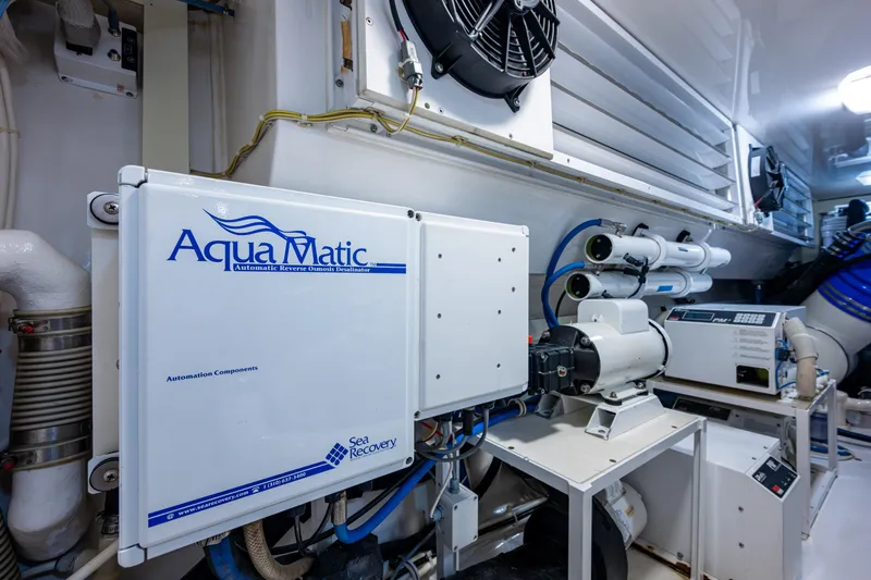 Slide: The Image of Engine room of 2008 Viking 74 Enclosed Bridge with Aqua Matic reverse osmosis system. - 76