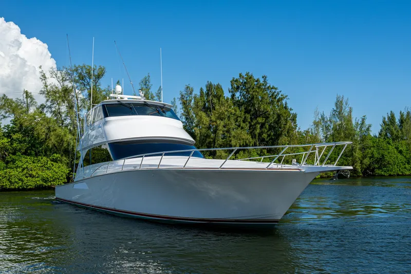 Slide: The Image of 2008 Viking 74 Enclosed Bridge yacht cruising on a scenic waterway. - 8