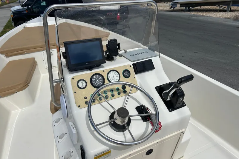 Slide: The Image of 1997 Sea Pro SV2100CC Bay Boat dashboard with steering wheel and navigation equipment. - 10